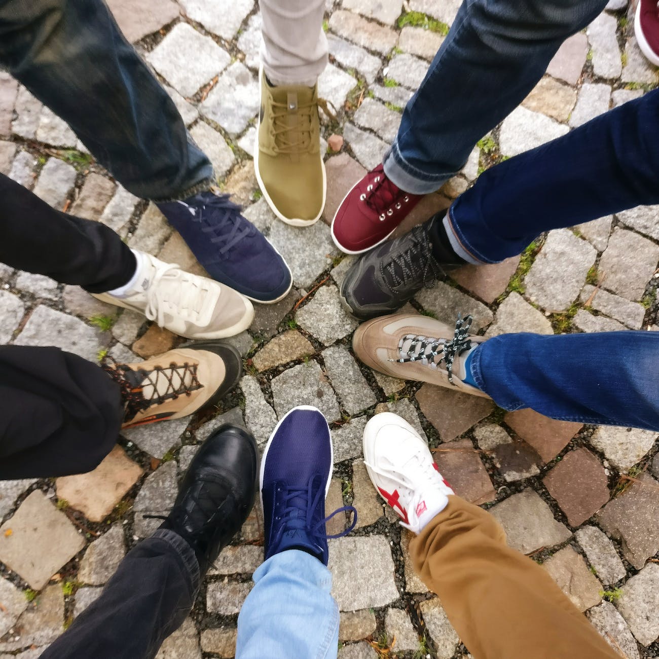 people forming round by shoes